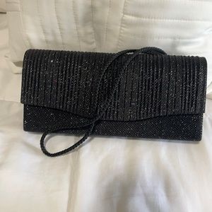 Beautiful Formal black purse with shoulder strap.